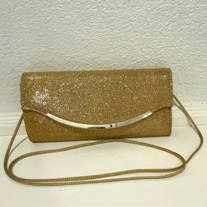 Gold clutch handbag with rope strap